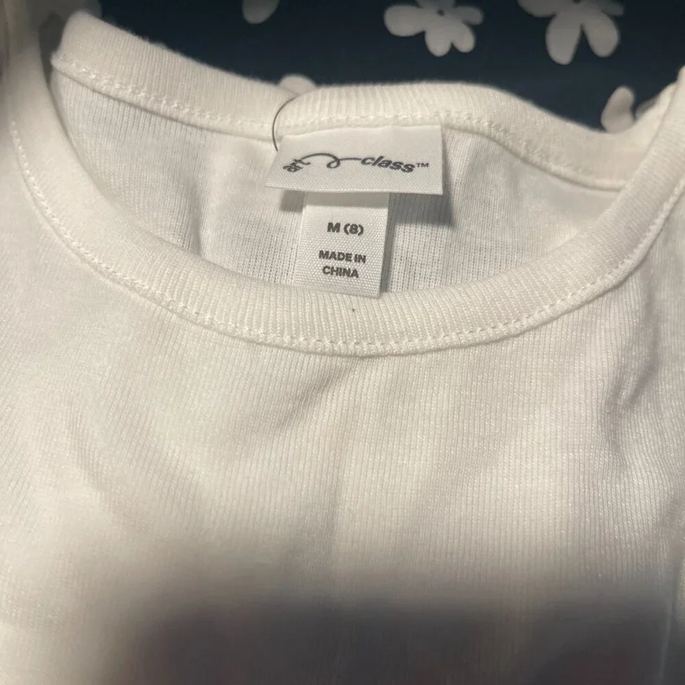 art class. Girls black and white floral print dress and white shirt sleeve. NWT